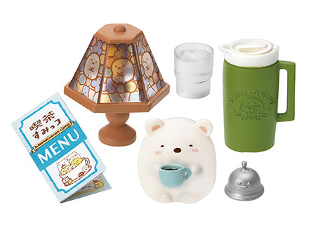 Sumikkogurashi Café miniature set with Shirokuma holding a cup, a character-patterned table lamp, menu, green thermos, glass, and service bell.