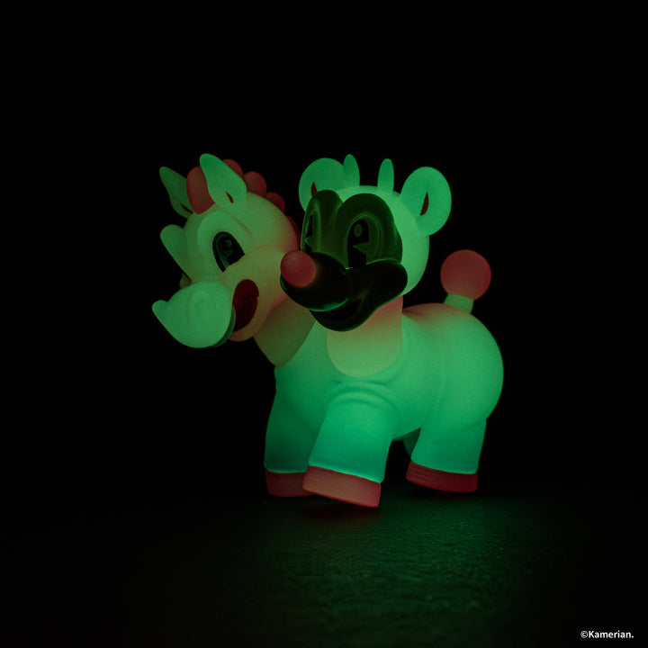 Luminous UMASHIKA figure glowing green in the dark