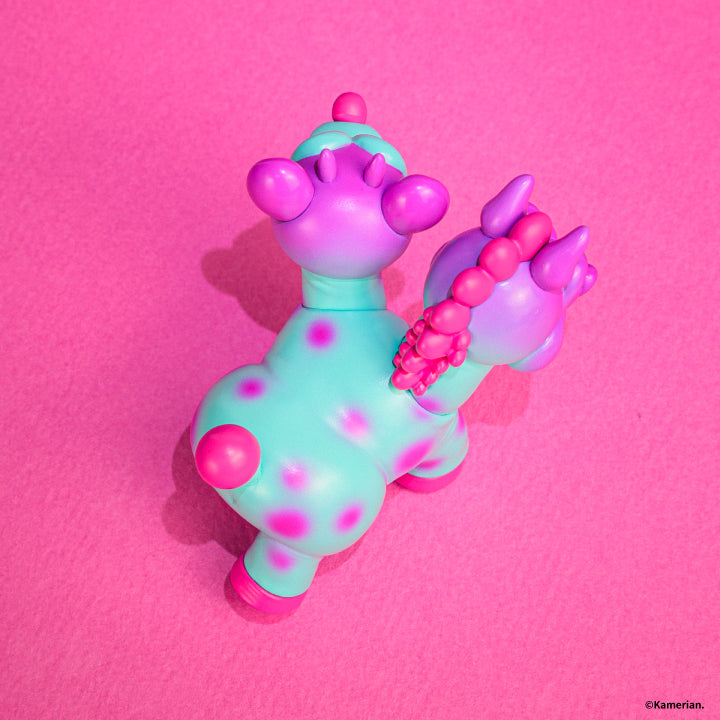 Overhead rear view of the Purple and Turquoise UMASHIKA figure on pink