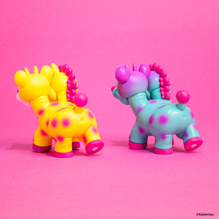 Rear view of Yellow and Purple-Turquoise UMASHIKA figures on a pink background
