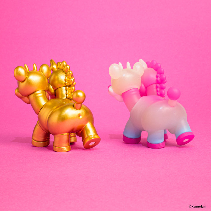 Rear view of Gold and Luminous UMASHIKA figures on a pink background