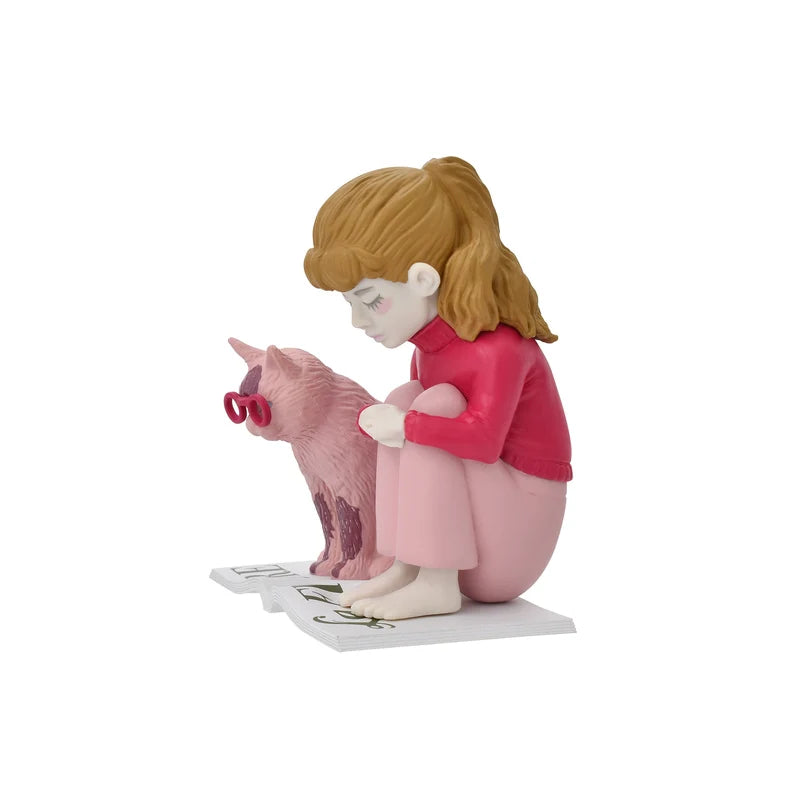 Girl in red next to cat in glasses reading book