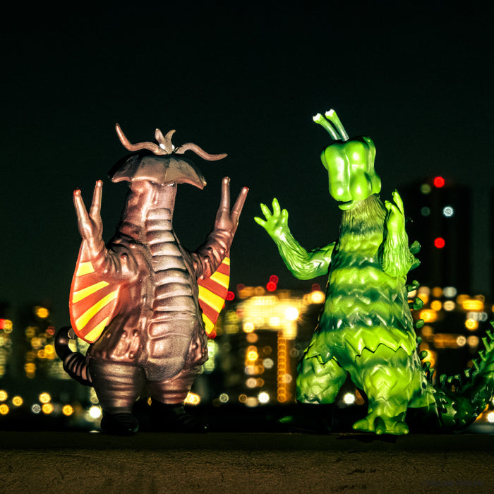 Second-Generation Kasabian and Vegetarigon figures in a nighttime city scene